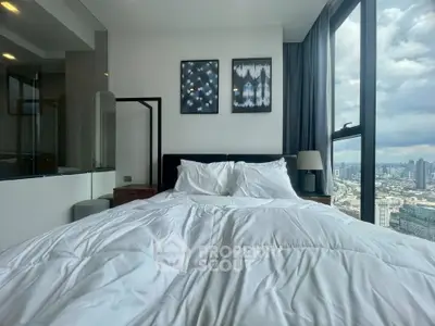 Luxurious bedroom with stunning city view and modern decor