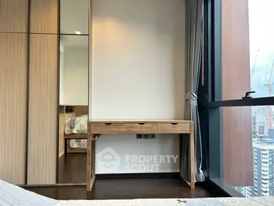 Modern bedroom with wooden furniture and city view window