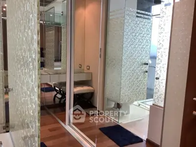 Luxurious bathroom with glass shower and elegant decor