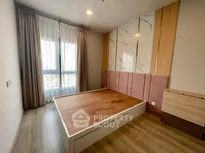 Modern bedroom with stylish wood flooring and elegant wall paneling