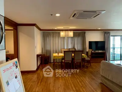 Spacious living room with dining area and modern decor