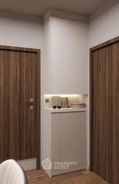 Modern interior hallway with sleek wooden doors and minimalist storage cabinet.