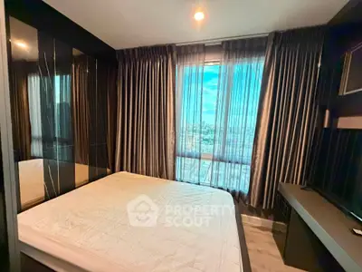 Modern bedroom with large window offering stunning city view, featuring sleek design and ample natural light.
