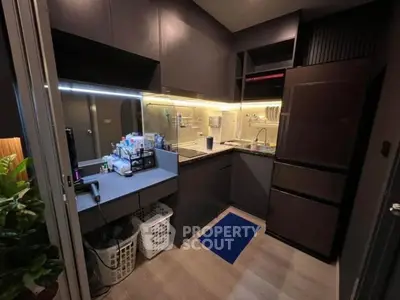 Modern compact kitchen with sleek cabinets and ambient lighting