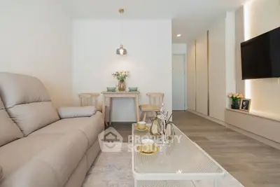Modern living room with cozy sofa, stylish coffee table, and elegant decor in a contemporary apartment.