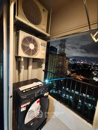 City view balcony with washing machine and air conditioning unit, perfect for urban living convenience.