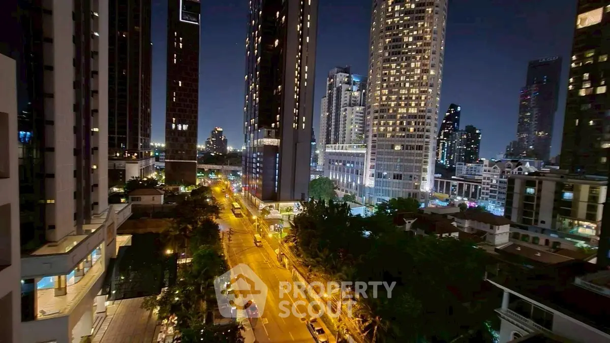 Stunning cityscape view from high-rise apartment balcony at night