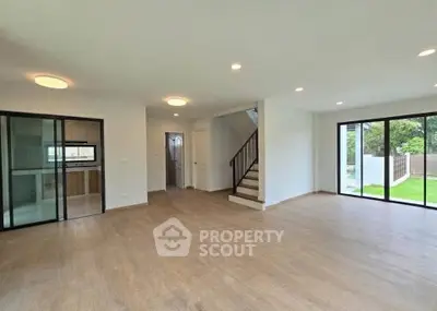 Spacious modern living room with open layout and garden view