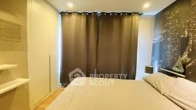 Cozy bedroom with cityscape wallpaper and modern lighting