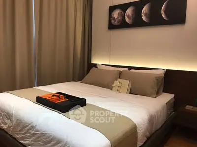 Elegant bedroom with moon phase artwork and cozy lighting