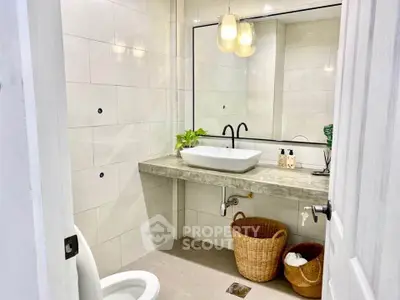 Modern bathroom with elegant sink and stylish lighting