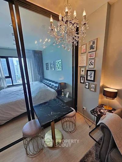 Luxurious modern bedroom with elegant chandelier and stylish decor