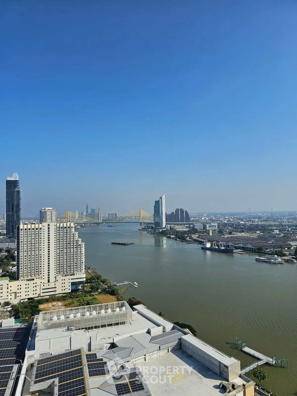 Stunning cityscape view of river and skyline from high-rise building