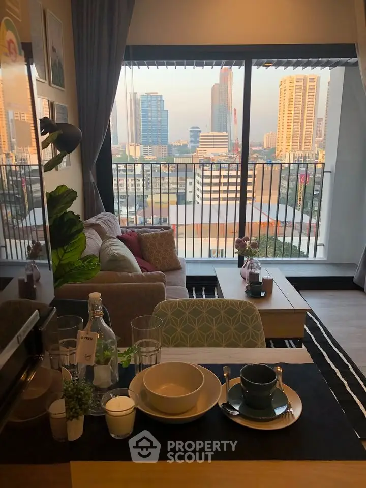 Modern living room with city view, cozy seating, and stylish decor in urban apartment.