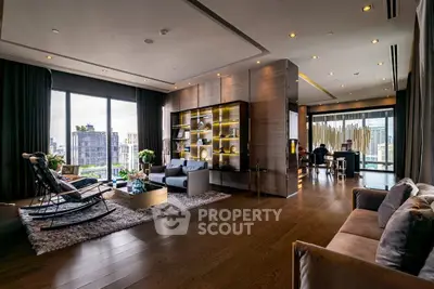 Luxurious modern living room with city view, elegant decor, and spacious layout.