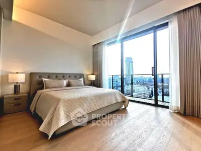 Luxurious bedroom with floor-to-ceiling windows offering stunning city views.