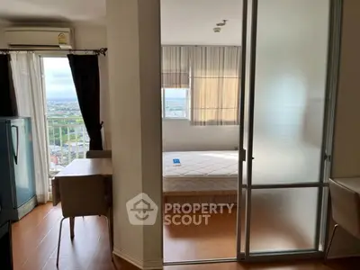 Modern apartment with balcony view and cozy bedroom setup