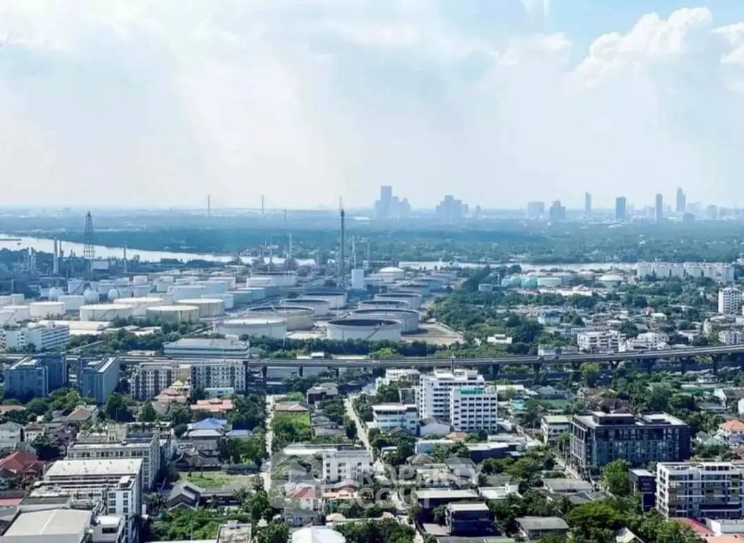 Stunning aerial view of urban landscape with skyline and river, showcasing vibrant city life and architecture.