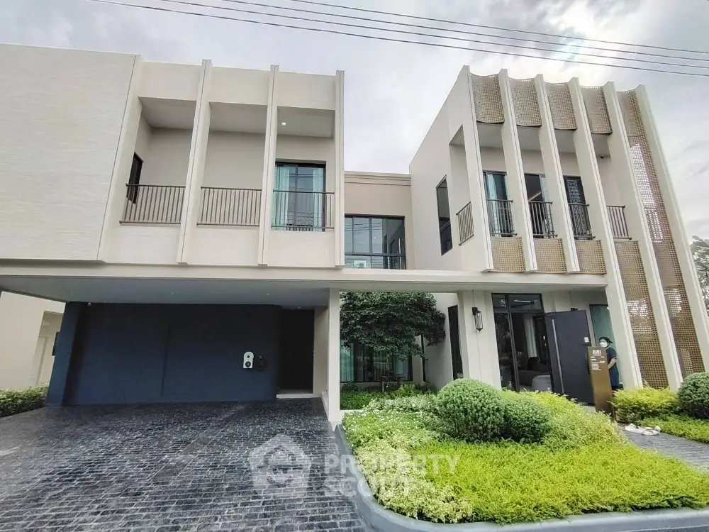 Modern luxury house exterior with unique architectural design and lush landscaping