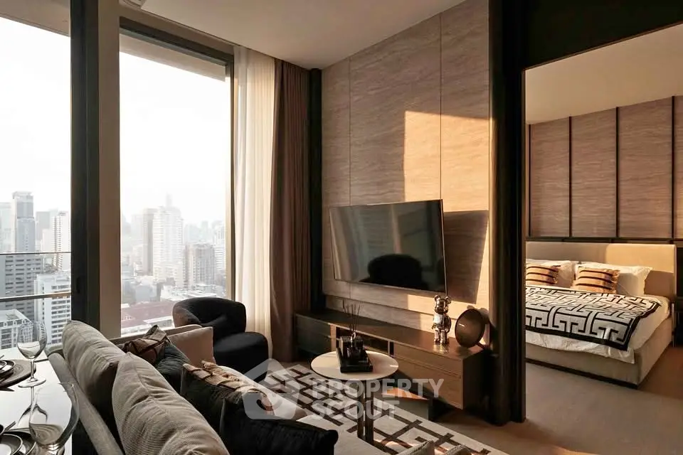 Luxurious modern living room with city view, elegant decor, and adjacent stylish bedroom.