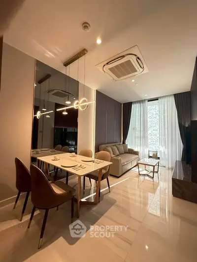 Luxurious modern living room with elegant dining area and stylish lighting in a high-end apartment.