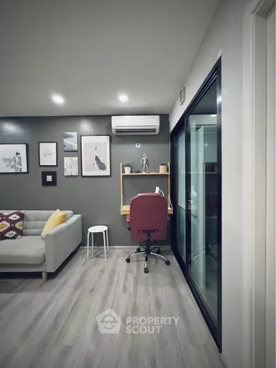 Modern living room with stylish decor and cozy workspace