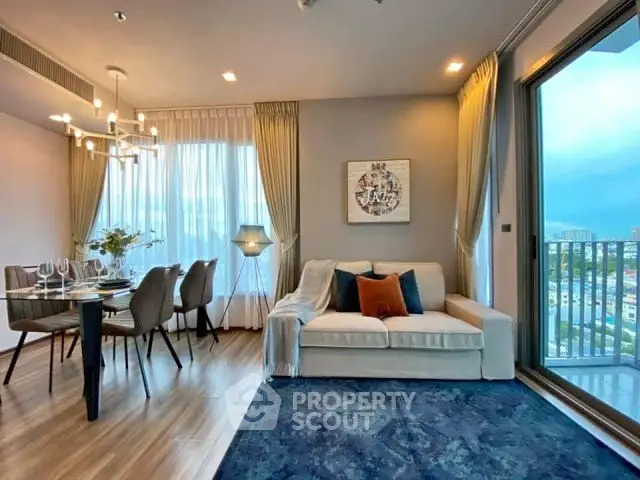 Luxurious modern living room with elegant dining area and stunning city view from balcony.