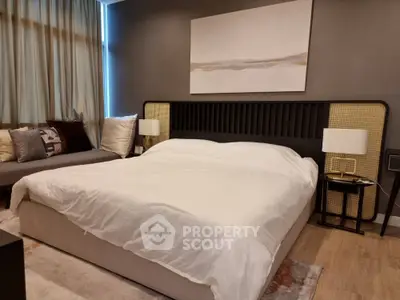 Elegant bedroom with a large comfortable bed, stylish headboard, and modern decor, perfect for relaxation and tranquility in a luxurious home setting.