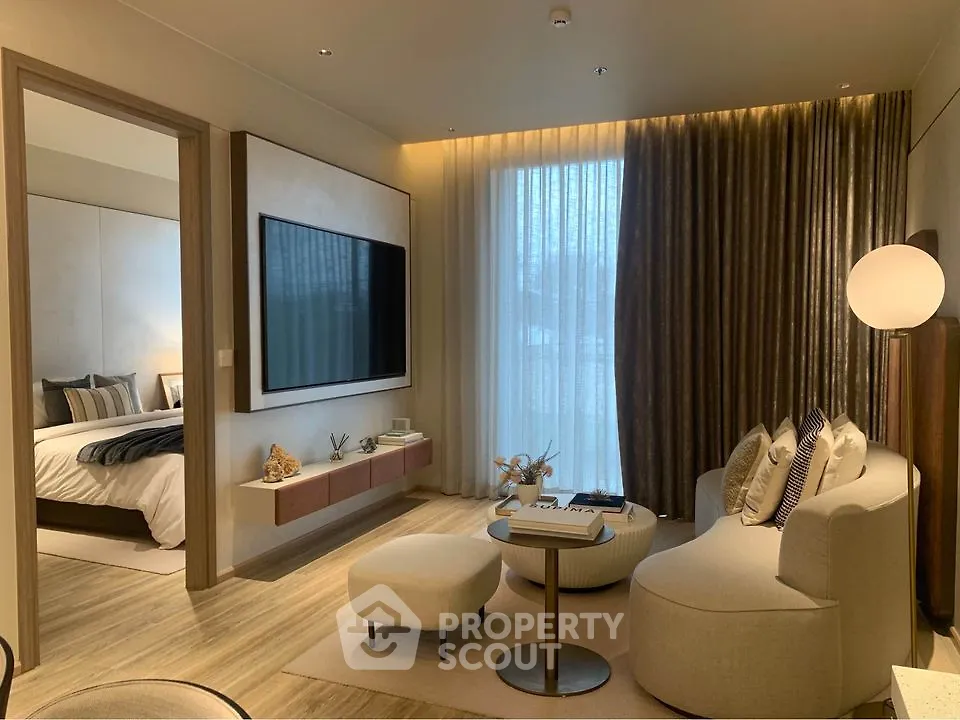 Modern living room with elegant decor and cozy bedroom view