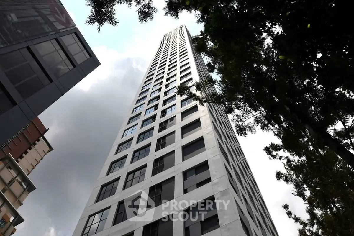 Stunning high-rise building with modern architecture and sleek design in urban setting.