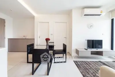 Modern living room with sleek furniture and air conditioning in a stylish apartment.