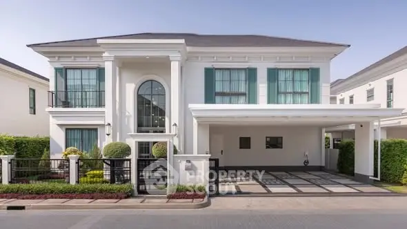 Luxurious modern two-story house with elegant facade and spacious driveway in a serene neighborhood.