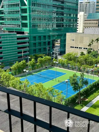 Stunning urban view with tennis courts and modern architecture, perfect for active lifestyle seekers.