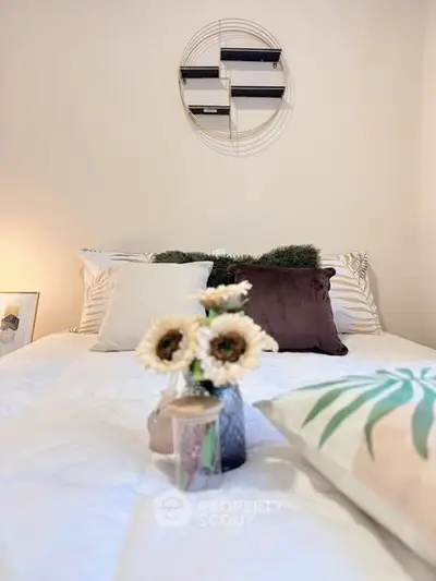 Cozy bedroom with stylish decor and plush pillows