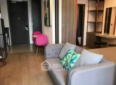 Stylish modern living room with cozy sofa and vibrant decor in a contemporary apartment.