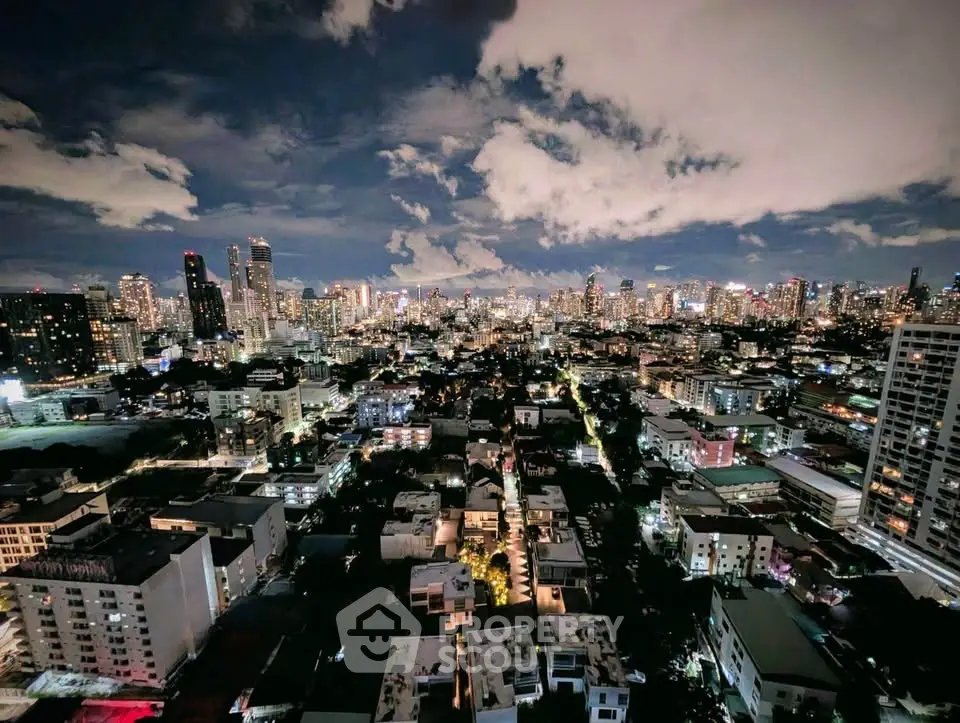 Stunning cityscape view from high-rise building at night with vibrant skyline