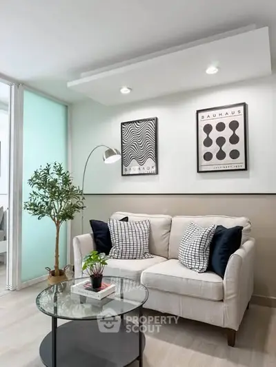 Stylish modern living room with cozy sofa, elegant decor, and ambient lighting