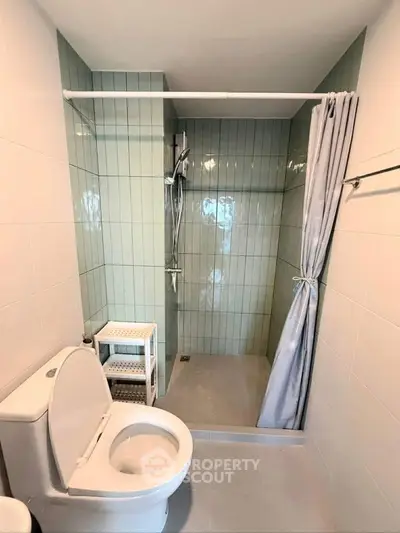 Modern bathroom with shower and toilet in sleek design