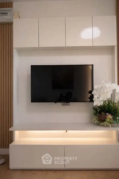 Modern living room with sleek TV unit and elegant decor