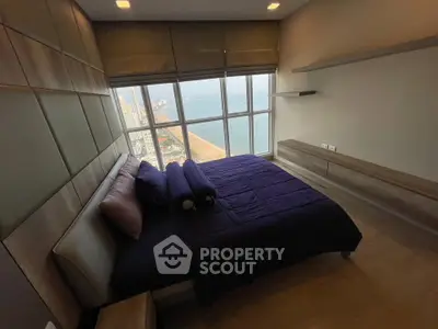 Luxurious bedroom with stunning ocean view and modern decor