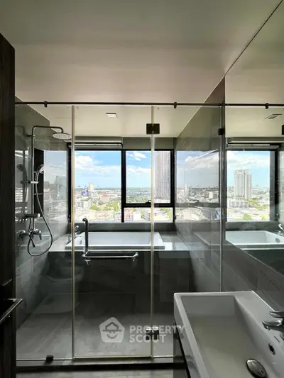 Luxurious bathroom with stunning city view, featuring glass shower and modern fixtures.