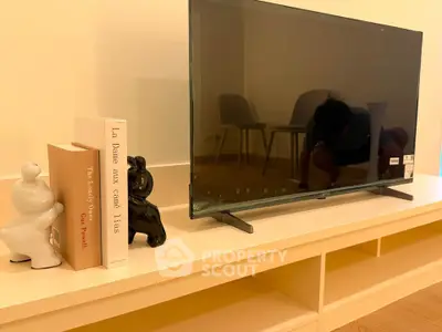 Modern living room with sleek TV setup and stylish decor