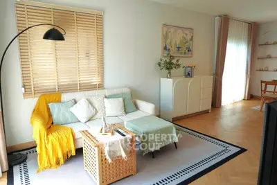 Charming living room with cozy sofa, stylish decor, and natural light