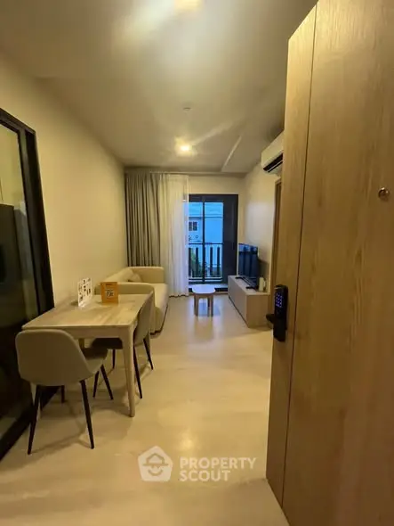 Modern living room with balcony access and stylish furniture