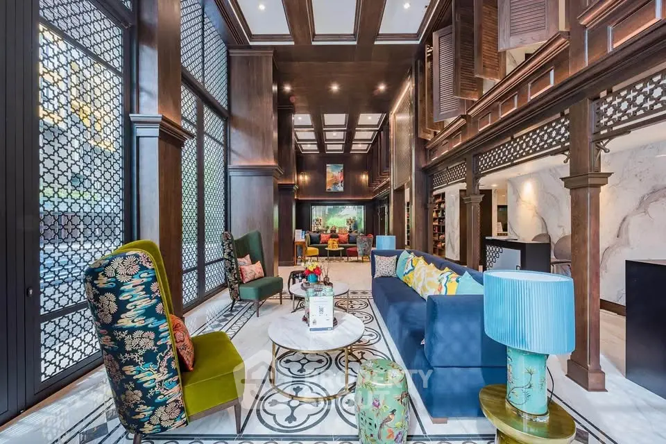 Luxurious living room with high ceilings, elegant decor, and vibrant furnishings in a sophisticated setting.