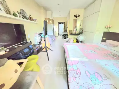Cozy bedroom with playful decor and ample storage space, perfect for a comfortable living experience.