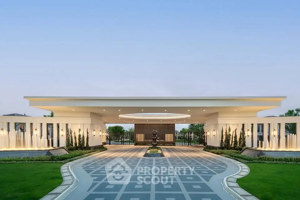 Luxurious modern entrance with elegant landscaping and architectural design