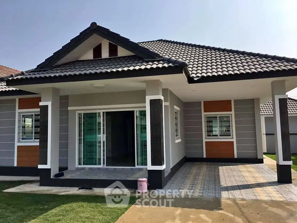 Charming single-story house with modern design and spacious front yard