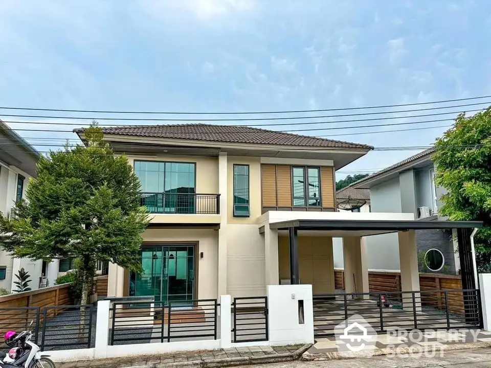 Modern two-story house with spacious driveway and contemporary design