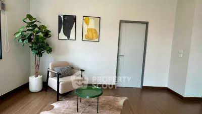 Modern living room with stylish decor and cozy seating area.